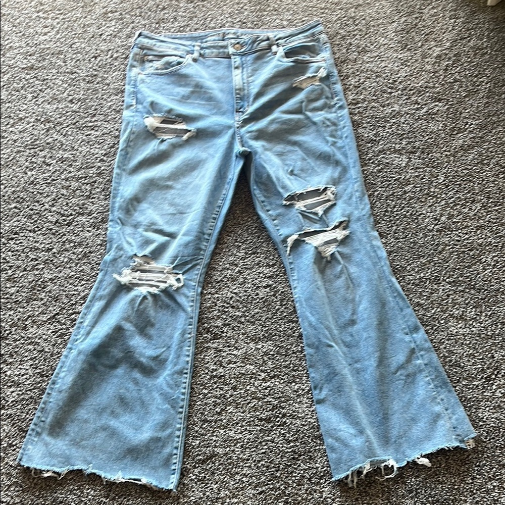 American Eagle Light Blue Flare Jeans with Distressing and Frayed Hem